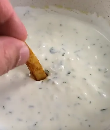 Three homemade sauces for high-protein meal prep bowls including green tahini, harissa cottage cheese, and garlic yogurt sauce