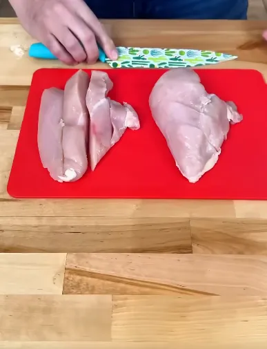 Chicken breasts, chicken thighs, and seasoned tofu roasting for high-protein meal prep