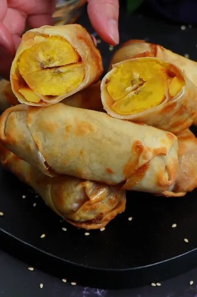 Crispy banana egg roll bites with caramel sauce
