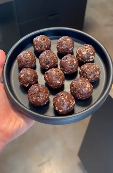 Chocolate protein bites on a small plate