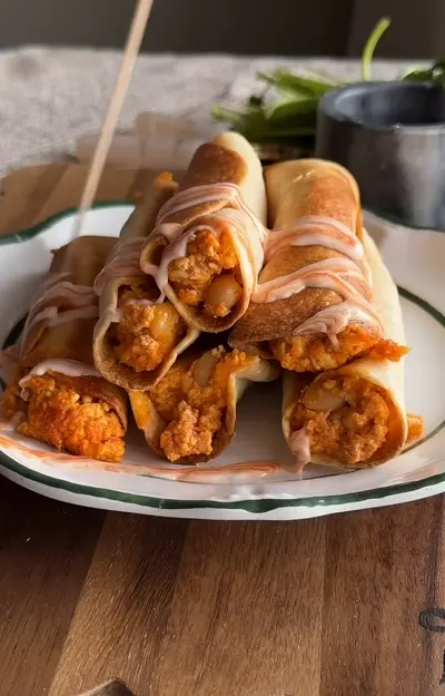 Crispy baked plant-based taquitos filled with vegetables and vegan ground meat