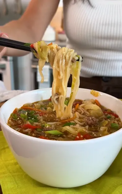 One-pot beef ramen skillet with vegetables and green onions