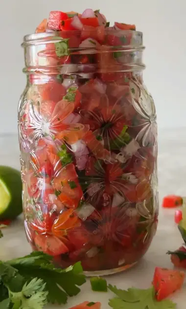 Fresh pico de gallo with tomatoes, red onion, jalapeño, cilantro, and lime