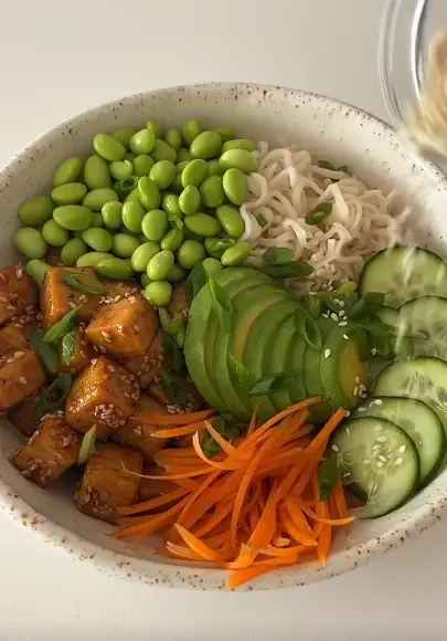 Tofu and edamame protein bowl with ground chicken and rice