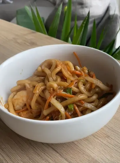 Yaki udon noodles with shrimp, cabbage, carrots, and mushrooms