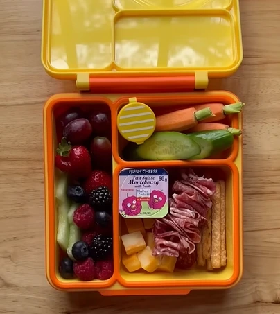 Divided bento-style lunchbox containers with separate compartments for school lunches