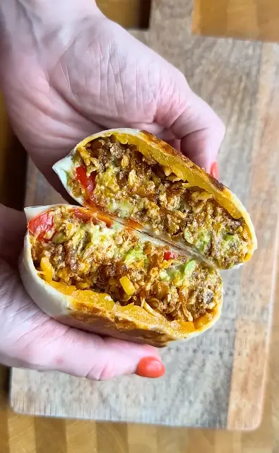 Toasted vegan tofu and bean burritos with cashew cheese sauce