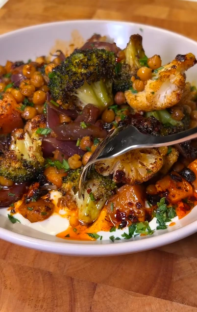 Mild vegan roasted vegetable curry with chickpeas, cauliflower, squash, potatoes, coconut milk, and rice